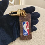 Louis Vuitton,  Louis Vuitton x NBA Letters Tab Key Holder & Bag Charm, , Brown, Very Very  Good - Image 3